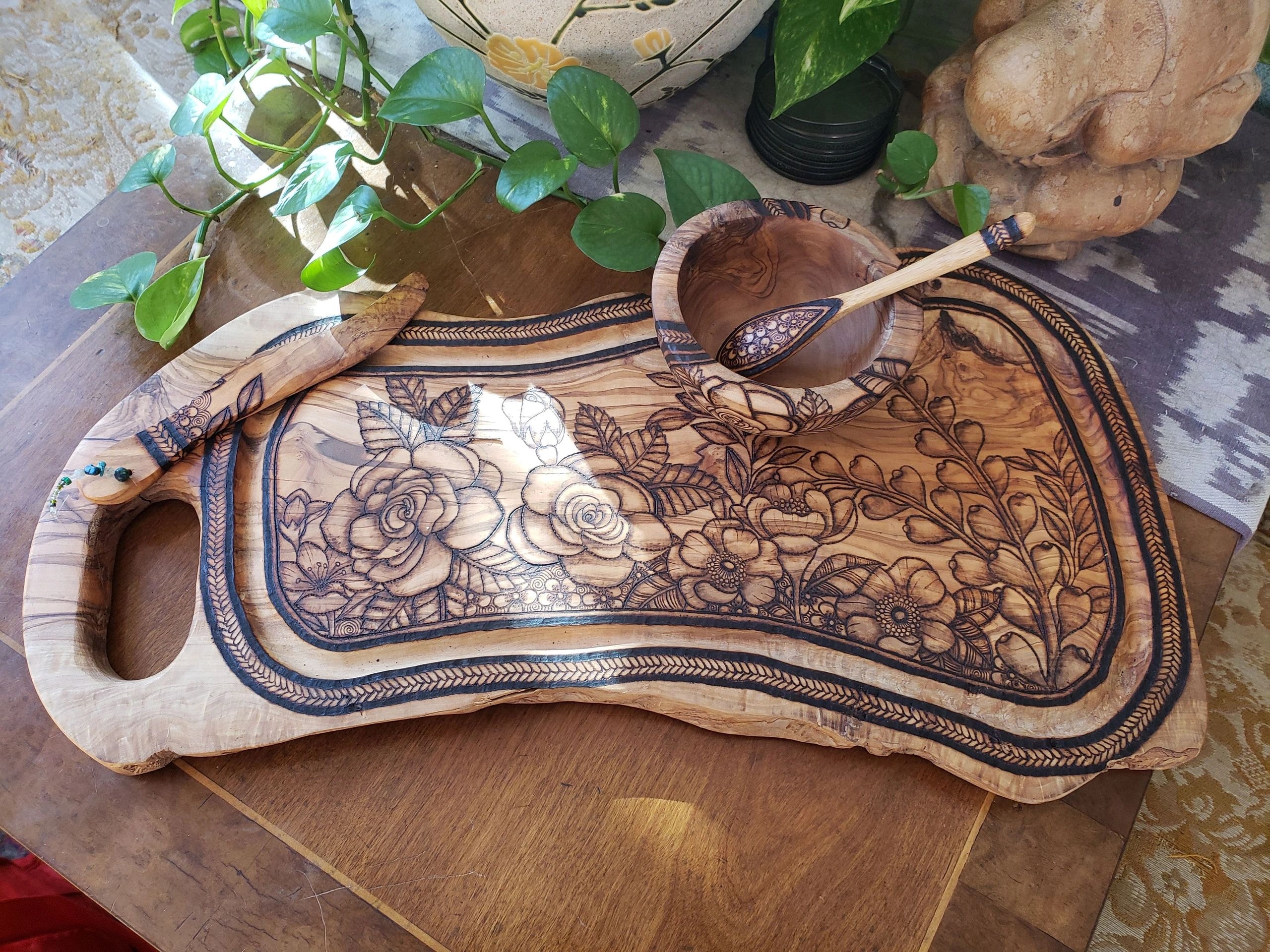 Handcrafted wood cutting boards with pyrography floral patterns